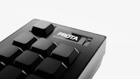 a close up of a black keyboard with the word prota on it